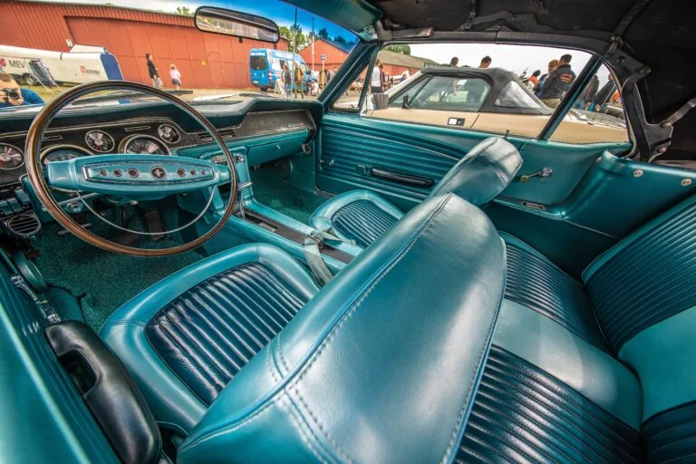 A closeup shot of the blue interior of a car during daytime